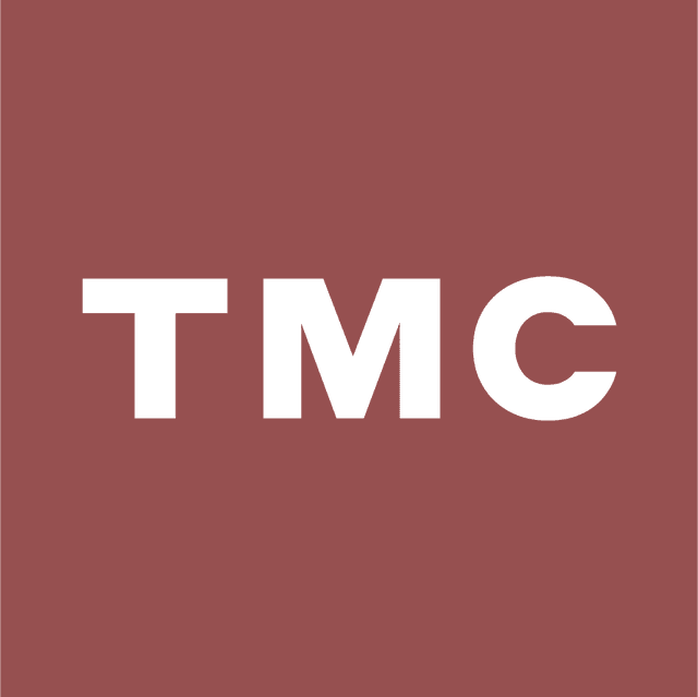 White "TMC" text on a solid maroon background.