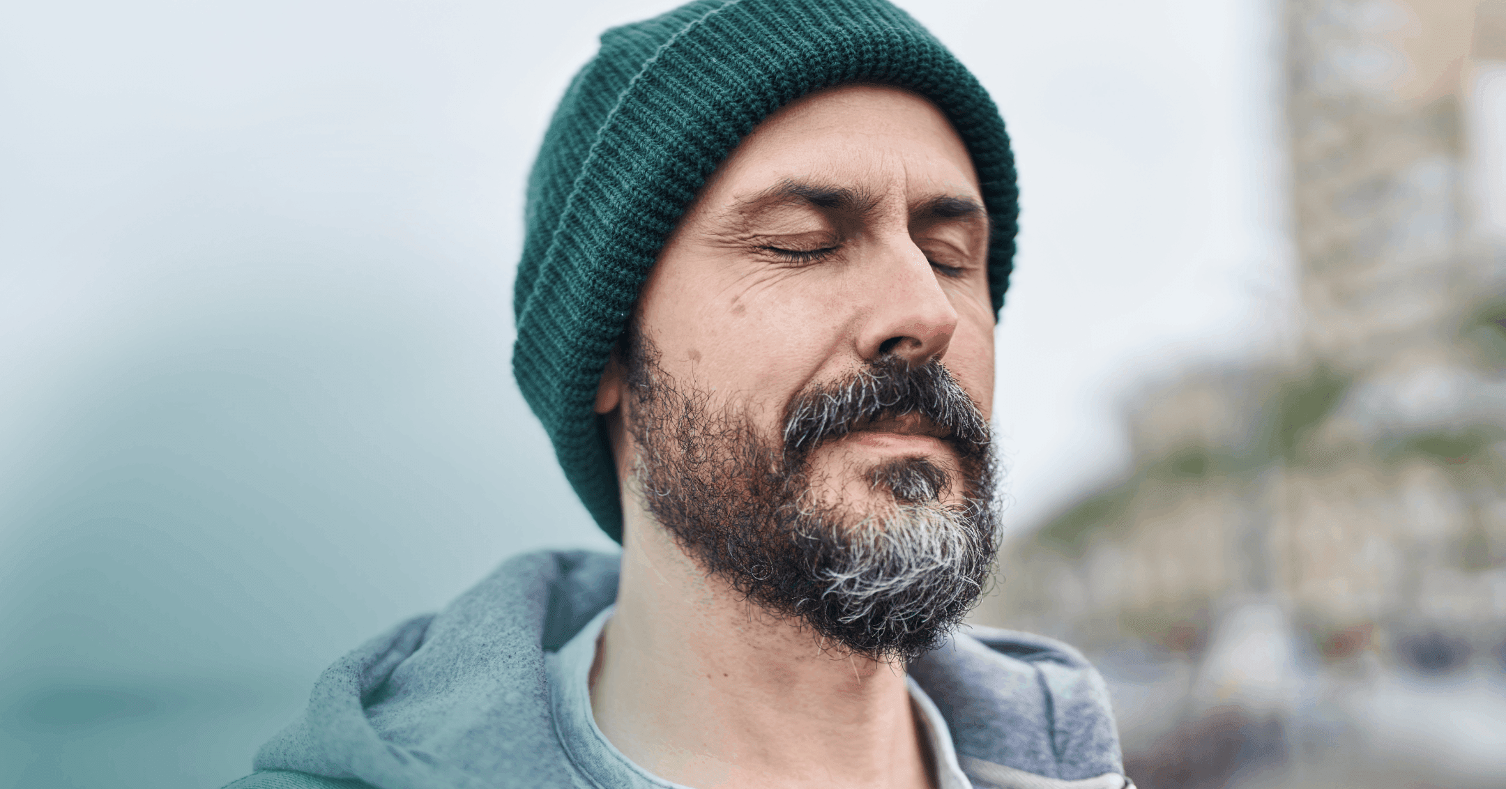 man pausing to reflect before reacting to change overly critical habits