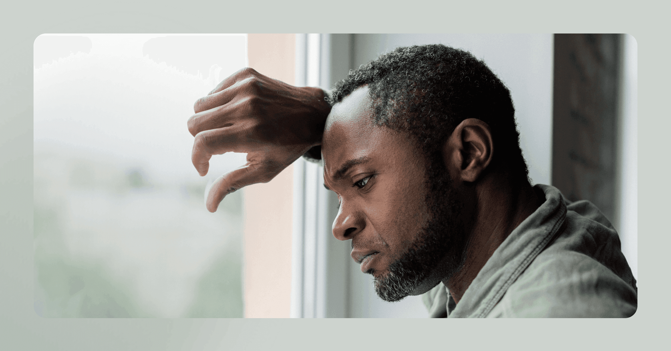 man experiencing a somatic flashback trying to stay grounded in the present moment