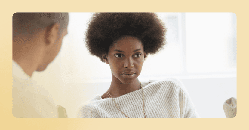 woman in a white sweater experiences retroactive jealousy