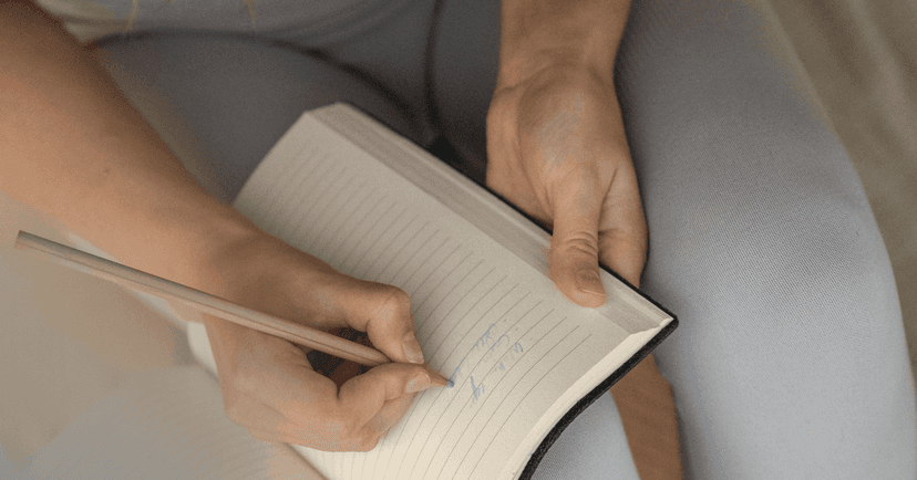 woman expressing emotions through journaling to prevent self-harming again