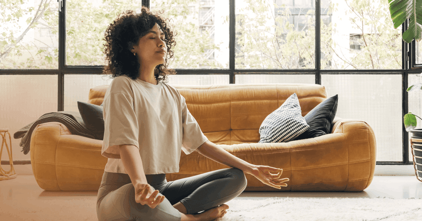 woman with depression practicing yoga at home