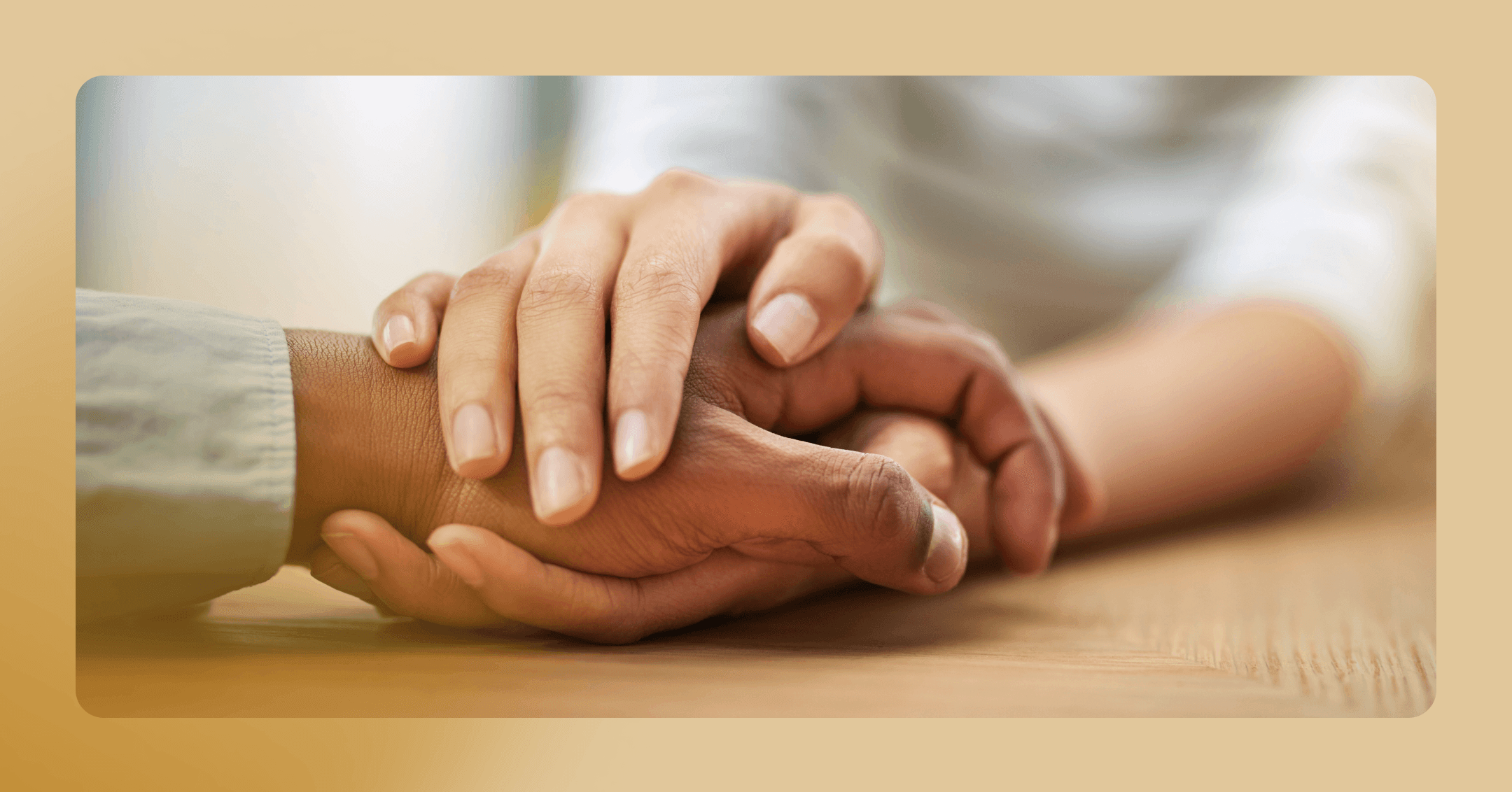 a man and an EFT therapist hold hands during a session