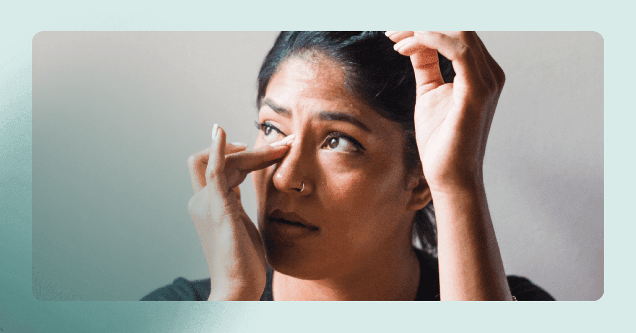 woman with PMDD and OCD wiping tears away