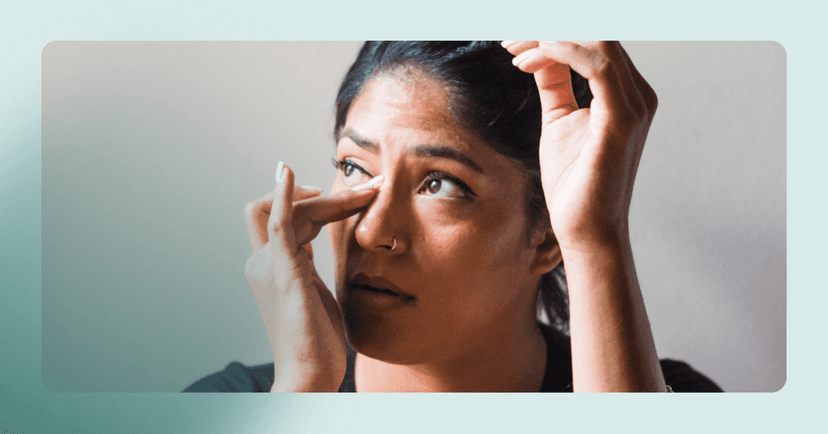 woman with PMDD and OCD wiping tears away