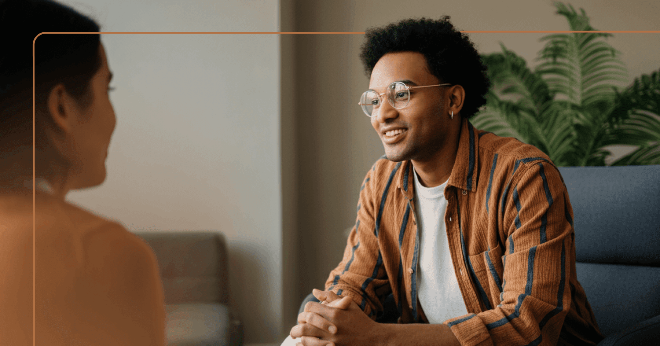 man with history of trauma engages in an in-person therapy session