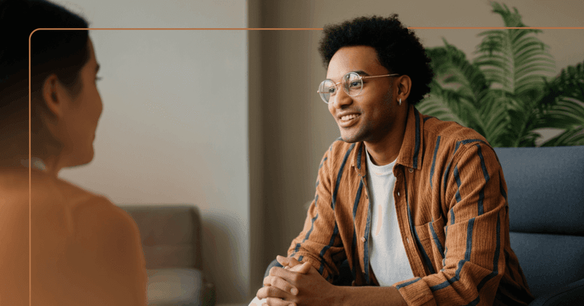 man with history of trauma engages in an in-person therapy session