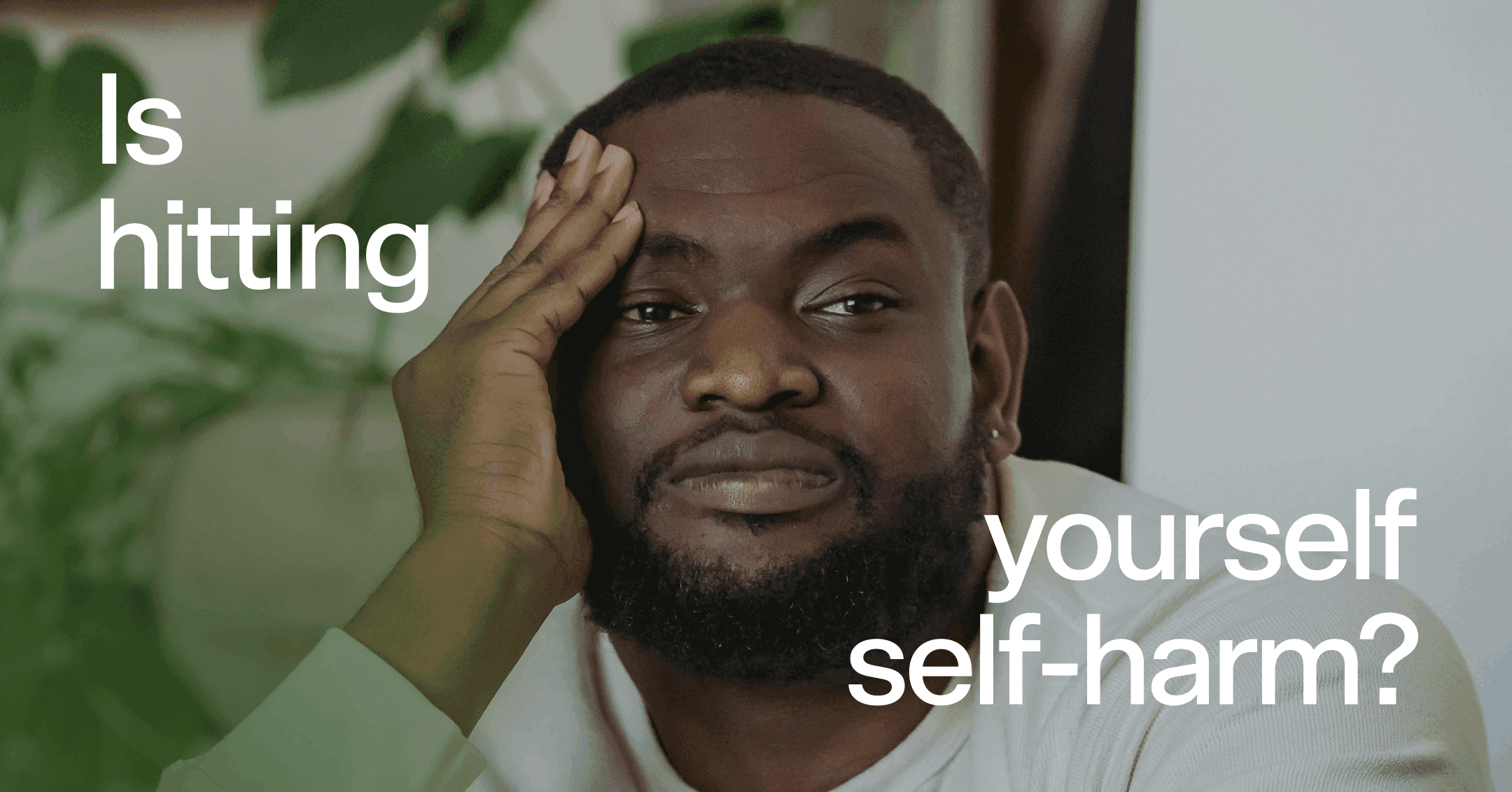 man trying to distract himself with text 'Is hitting yourself self-harm?'