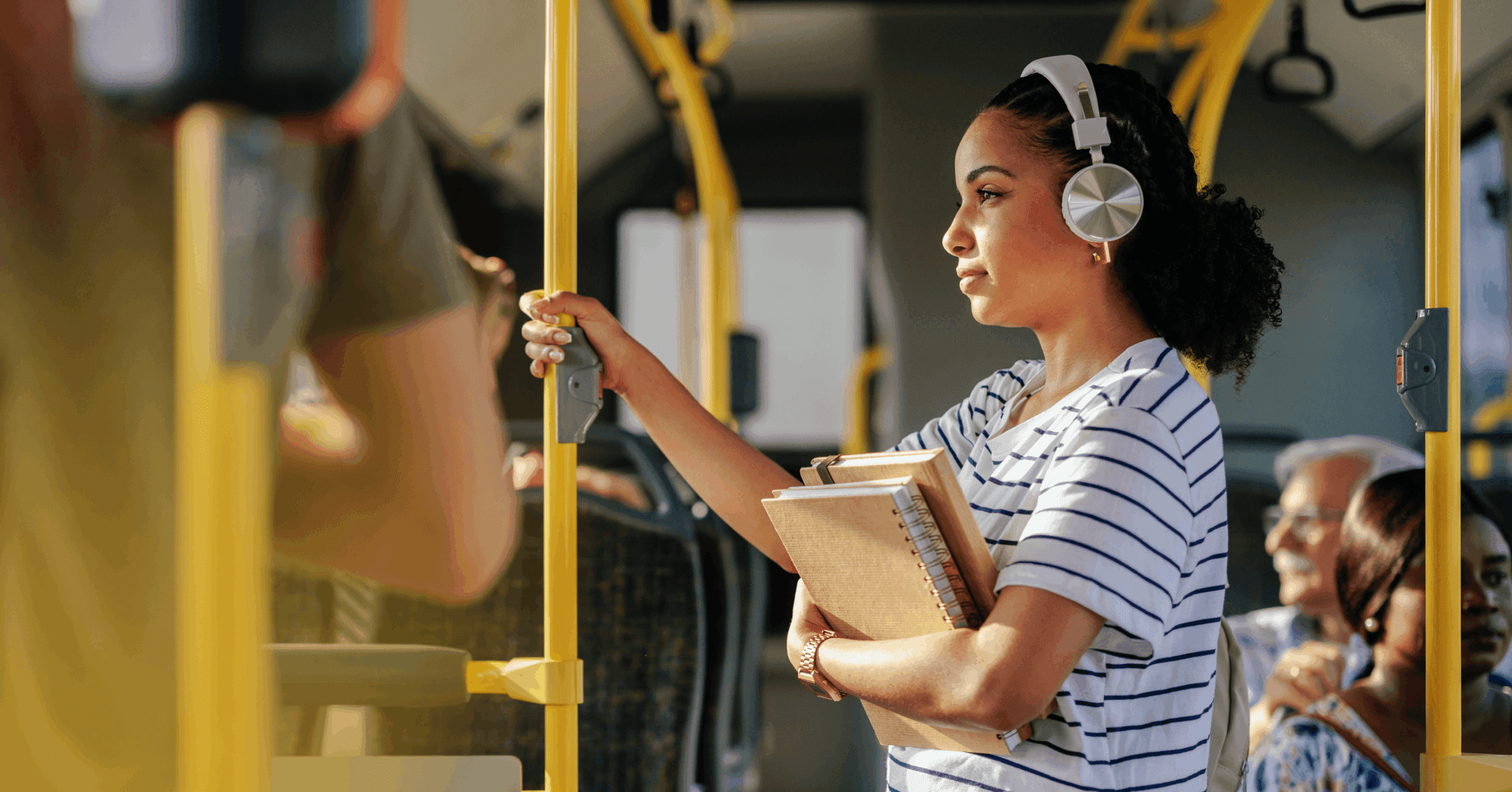 young woman with OCD using noise-canceling headphones on a bus