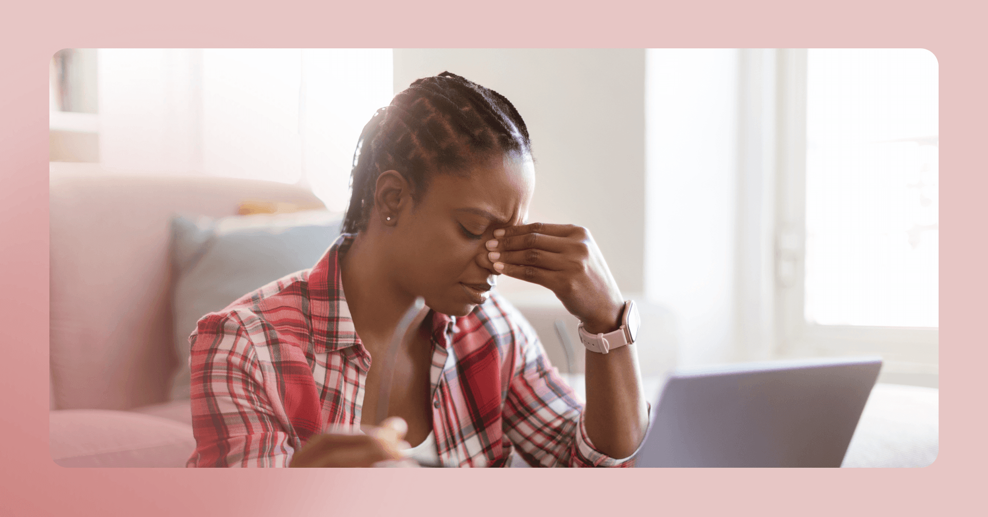 woman with a headache feeling overwhelmed