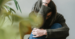 woman feeling afraid of being home alone