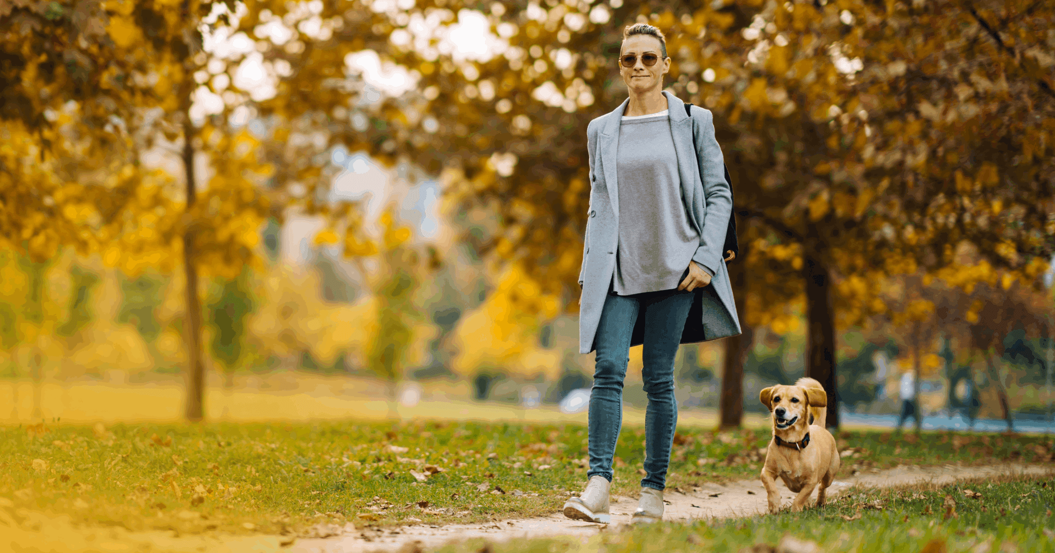 woman walking her dog as part of her daily routine