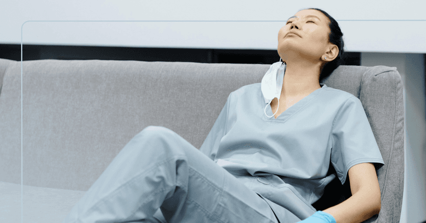 woman with depression associated with working the night shift struggling to stay awake at work