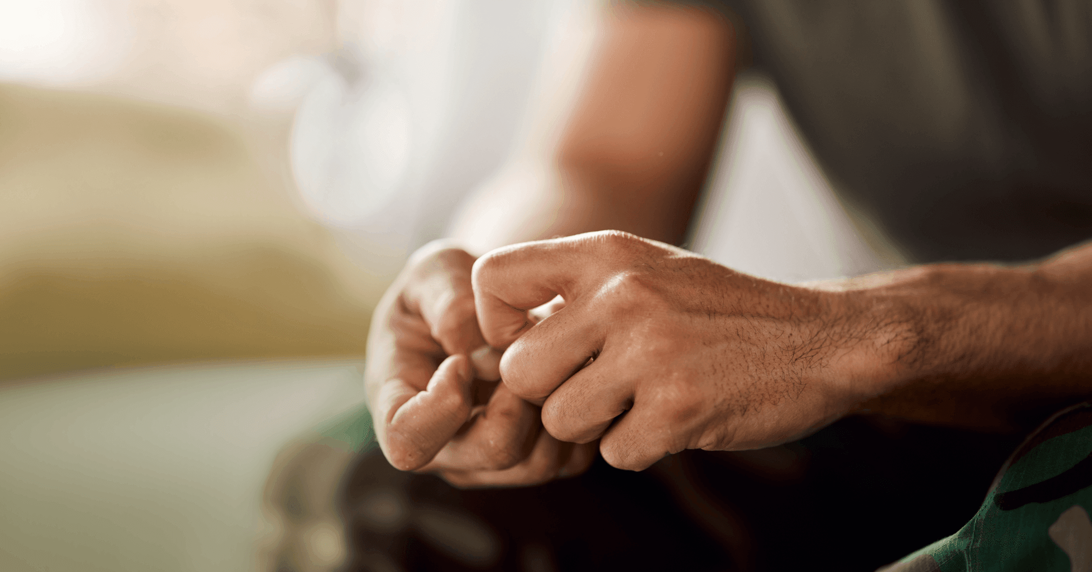 man with anxiety thinking about seeing a therapist to learn coping skills