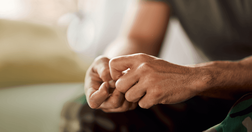man with anxiety thinking about seeing a therapist to learn coping skills
