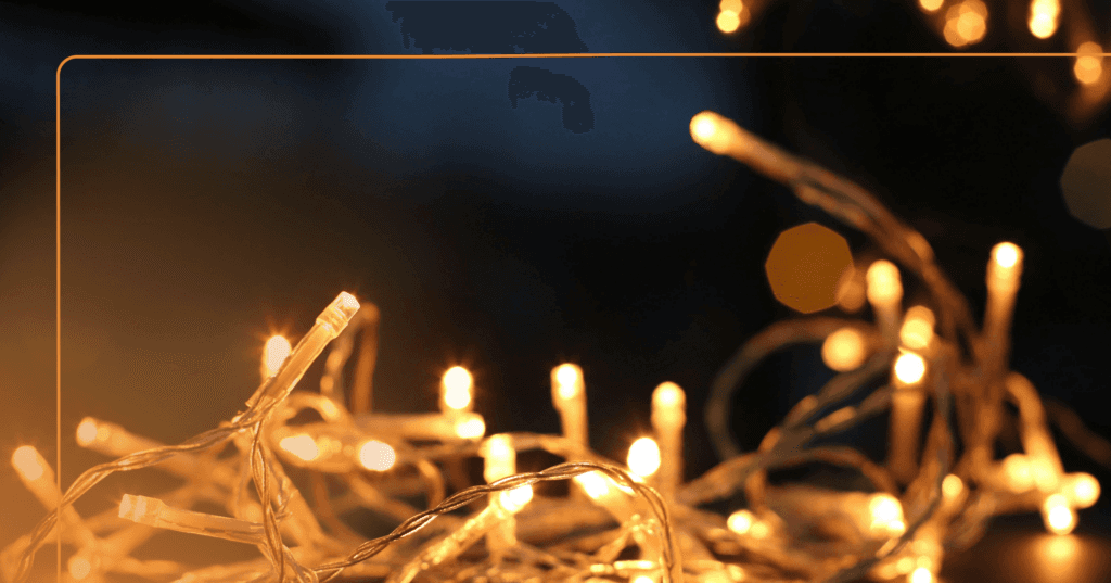 white twinkling lights are tangled, an example of unrealistic expectations during the holiday season