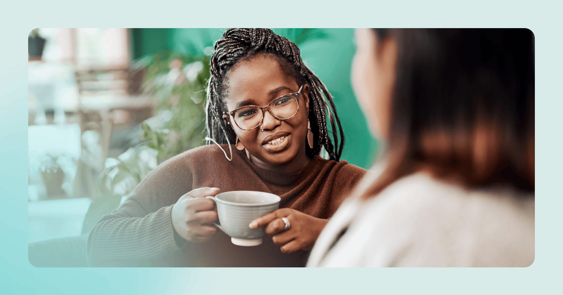 woman reaching out to someone with similar interests at a coffee shop