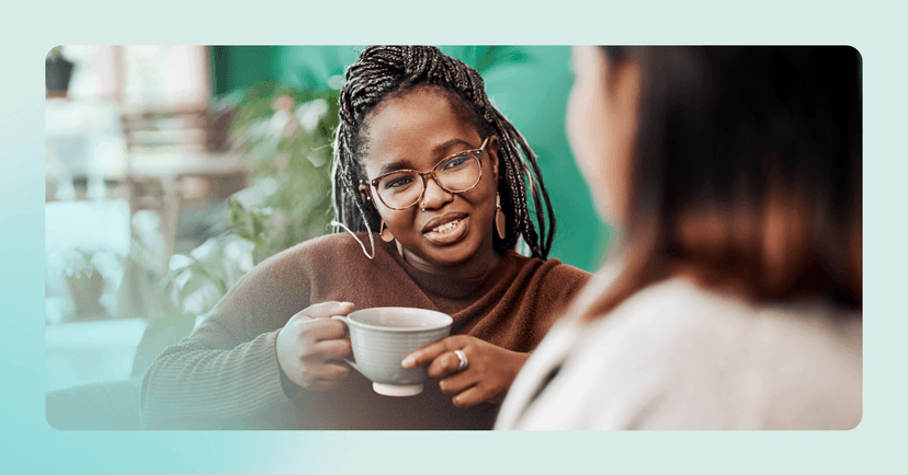 woman reaching out to someone with similar interests at a coffee shop