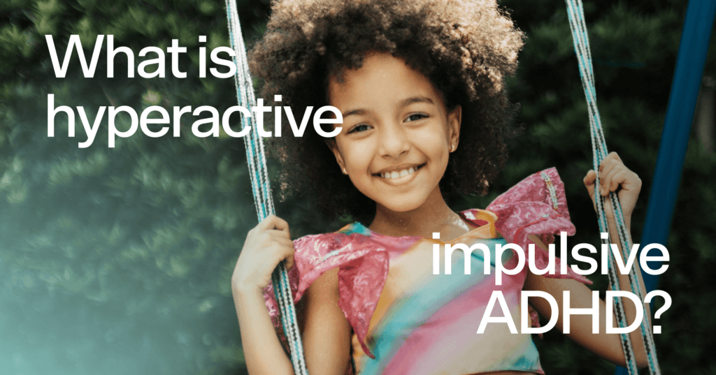 Girl is on a swing staring straight into the camera. She is smiling with all of her teeth. She is wearing a pink, yellow, blue, and orange top. In the background are trees. On top of the image in white text it reads What is hyperactive impulsive ADHD?