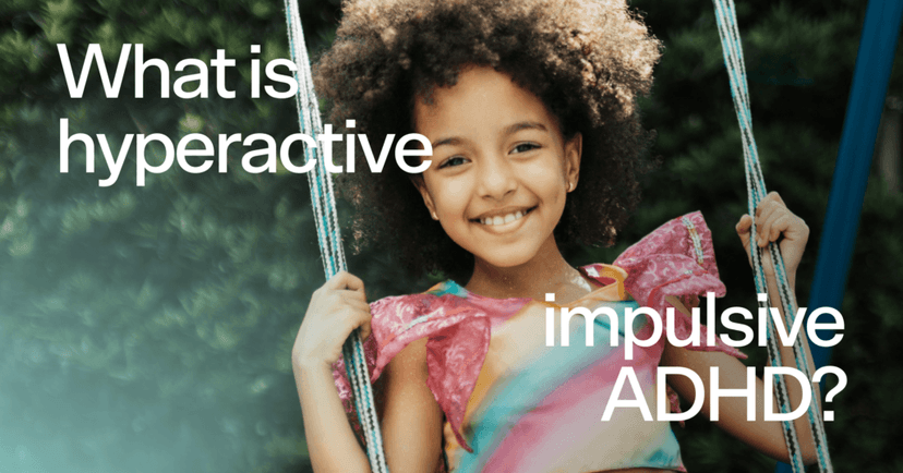 Girl is on a swing staring straight into the camera. She is smiling with all of her teeth. She is wearing a pink, yellow, blue, and orange top. In the background are trees. On top of the image in white text it reads What is hyperactive impulsive ADHD?