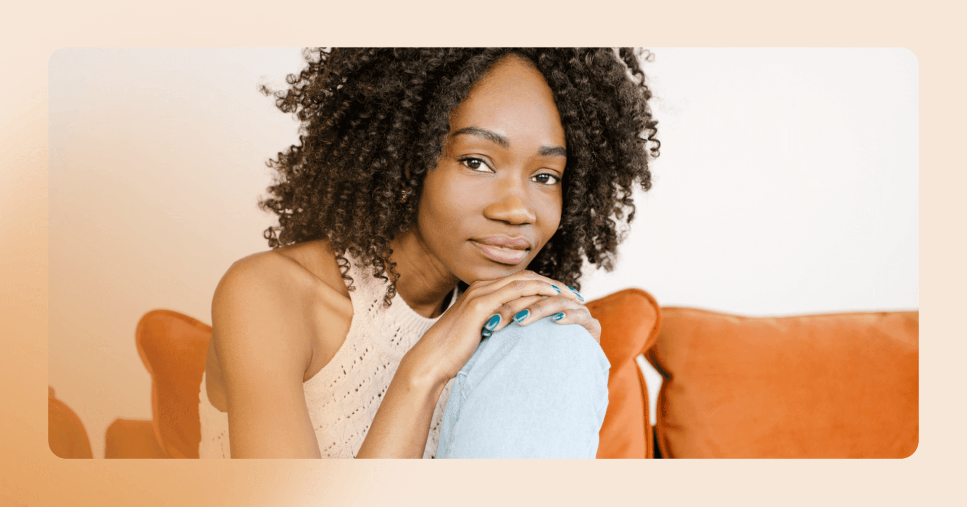woman sits on couch contemplating starting therapy