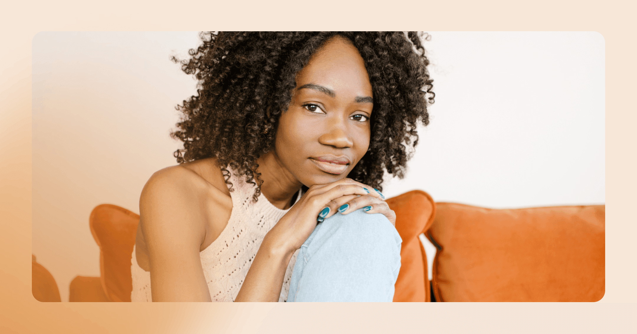 woman sits on couch contemplating starting therapy