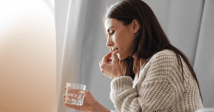 woman taking medication after meeting with a psychiatric provider and discussing treatment options