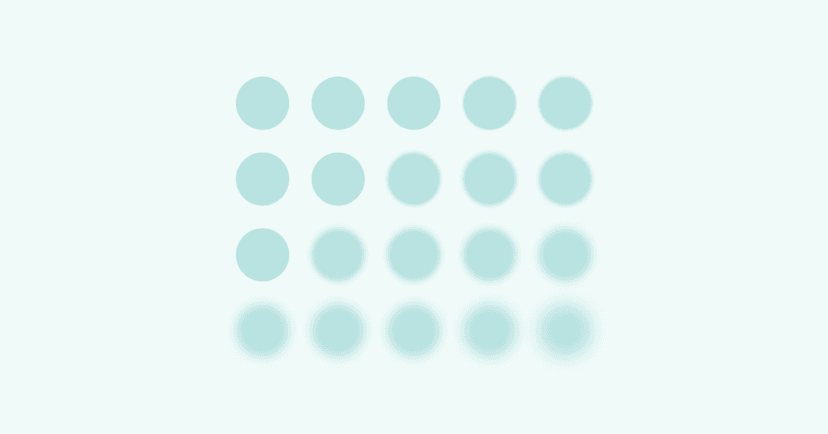 Image shows small blue circles. The circles are all the same size in rows. On the left side of the screen, the circles are in sharp focus. On the right side, the circles are blurry.