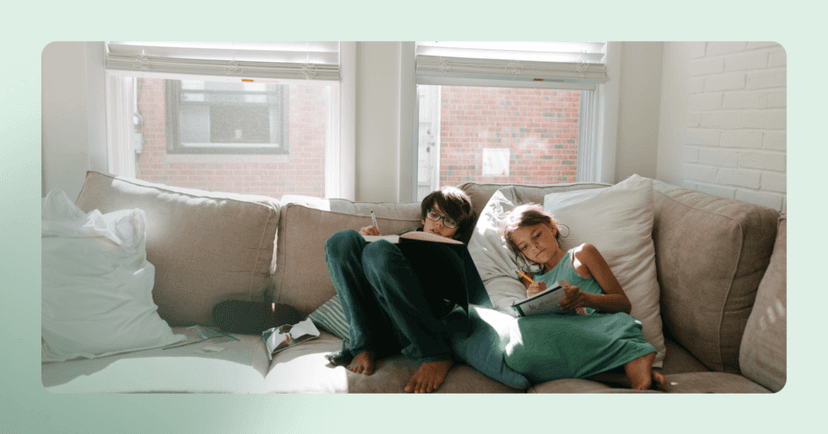 two young children acting like they can't do their homework to get help and attention