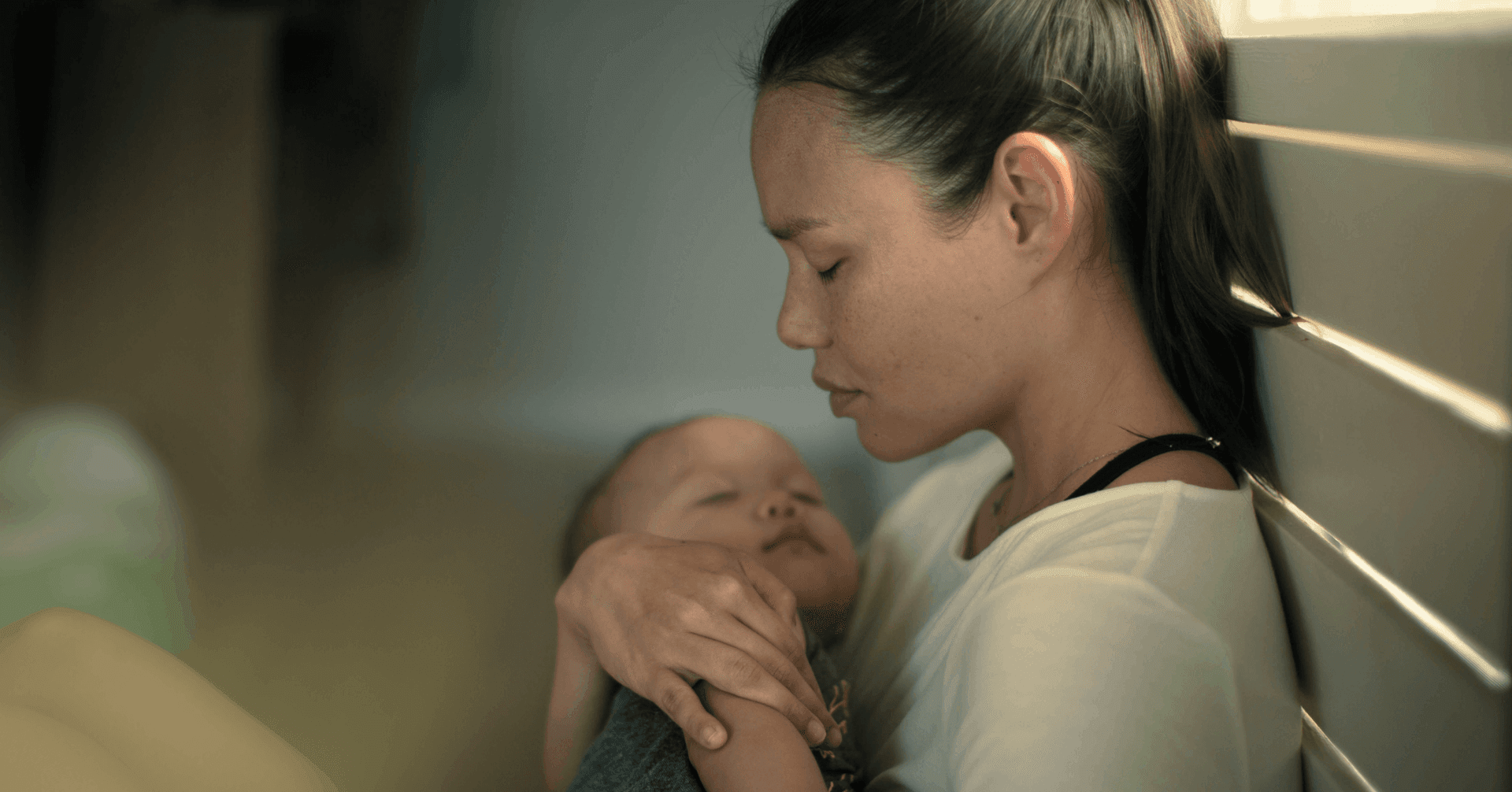 woman becoming impatient with her baby due to postpartum rage