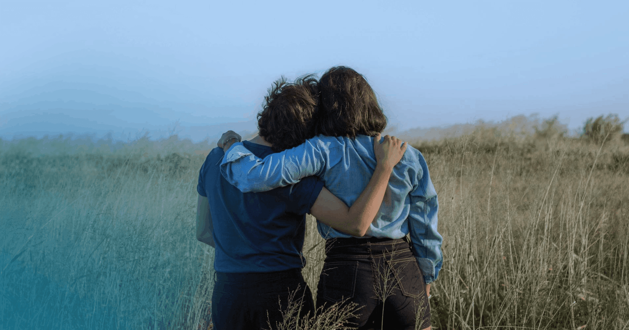 two friends in a quiet private location talking about self-harm