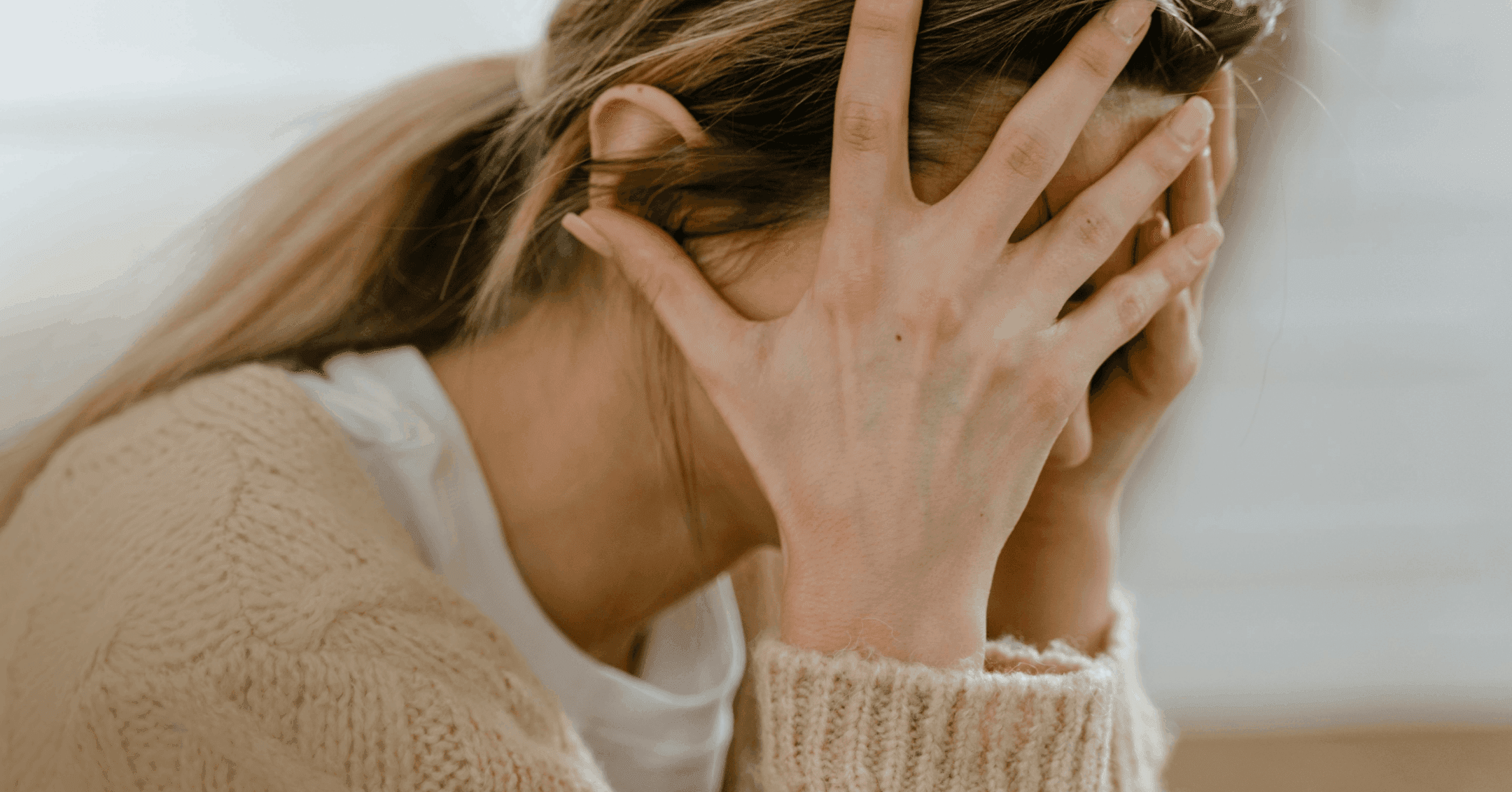 woman trying to cope with the urge to pull her hair out