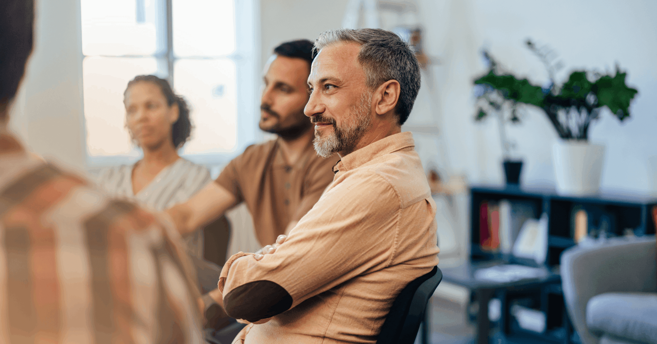 man spending time with his support network at a trauma support group